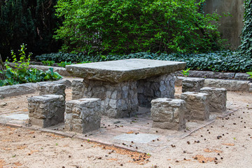 A place to relax in the fresh air. Stone table. Stone seat.