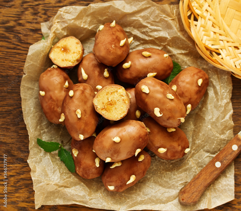 Poster Chocolate cake with cream in the form of potatoes.