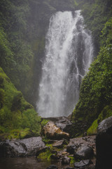 Fototapeta na wymiar Cascadas de peguche,.A small beautiful waterfall in a lush green environmnent in Ecuador, close to Otavalo.