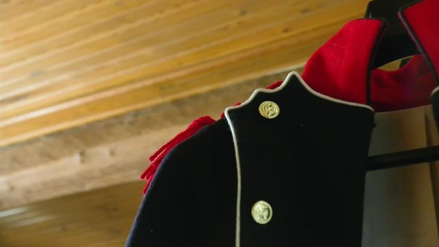 Costume of a french soldier during the battle of waterloo. Pan shot close.