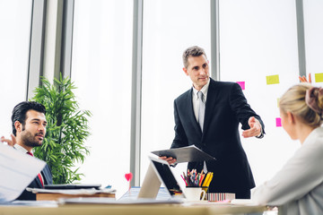 Group of professional business meeting and discussing strategy with new startup project.Creative business people planning and brainstorm with laptop computer in modern office.Teamwork concept