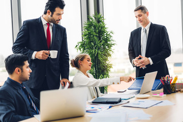 Group of professional business meeting and discussing strategy with new startup project.Creative business people planning and brainstorm with laptop computer in modern office.Teamwork concept