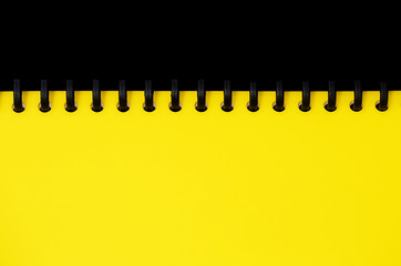 yellow spiral document wallet with black background for copy space