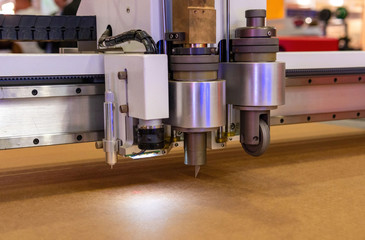 Cutting plotter close-up. The process of cutting.
