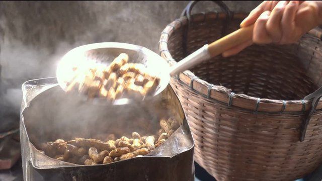 The vendors are boiling peanuts for sale.
