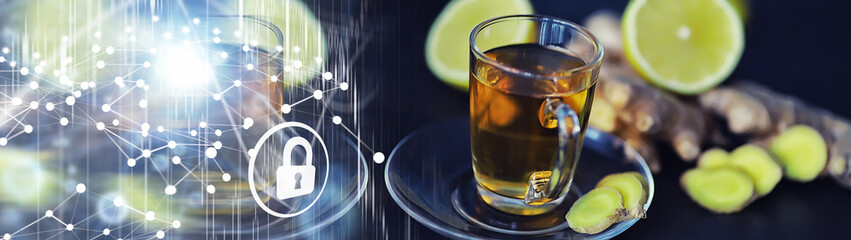 Ginger root whole and sliced. Ginger tea with lemon on the dark background. Fresh ginger root on stone background. Vitamins. Free space for your text.