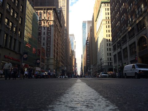 Surface Level View Of White Road Marking On City Street