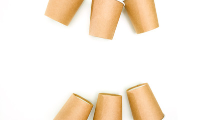 six disposable paper cups made of cardboard on a white background with space for text.