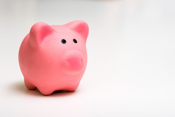 Pink piggy Bank On a white background. The concept of savings, financial management.