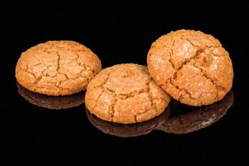 Tasty cookies with walnuts with reflection, isolated on black background.