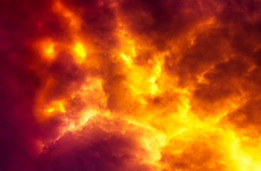 Flame are burning on clouds in dark red sky