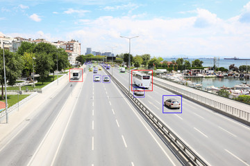 Fototapeta na wymiar City road with scanner frames on cars near sea. Machine learning