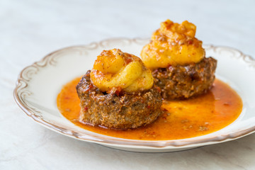 Turkish Food Hasanpasa Kofte / Kofta with Puree / Meatball with Bechamel, Tomato Paste Sauce and Green Peas.