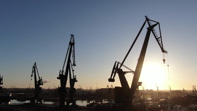 Gdańsk Shipyard cranes during a sunrise