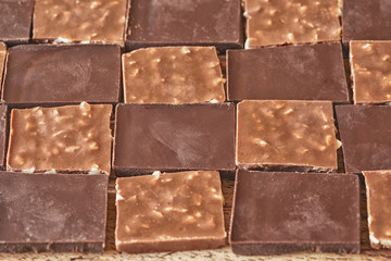 pieces of different milk chocolate are carefully laid out in a staggered order
