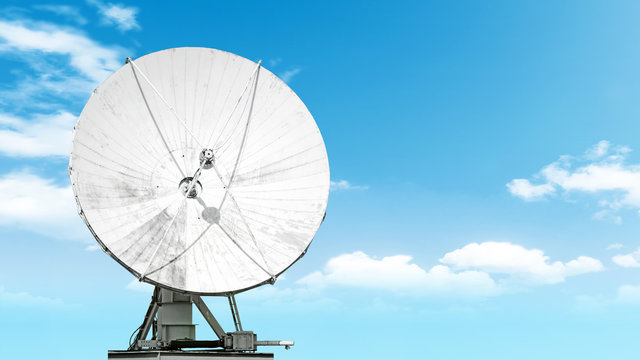 satellite antenna isolated on blue sky background Front view of modern radio communication equipment Digital tv broadcast signal receiving system wide copy space design backdrop