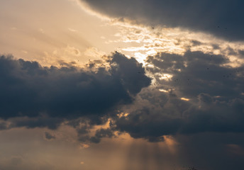 Dark sky with heavy and rainy clouds.