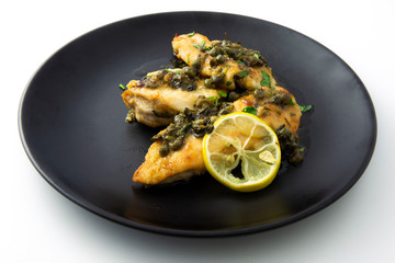 Chicken piccata with sauce, lemon and capers