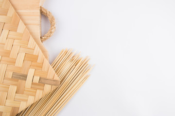 Arranging decoration of satay meat. The concept of bamboo material equipment with a white space background.