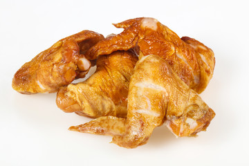 Smoked chicken wings over white background