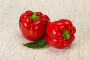 Ripe Red bell pepper over wooden