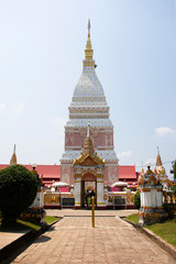 Pink and white color pagoda or stupa of Wat Phra That Renu Nakhon temple for foreign traveler and thai people travel visit and respect praying buddha and buddha's relics in Nakhon Phanom, Thailand