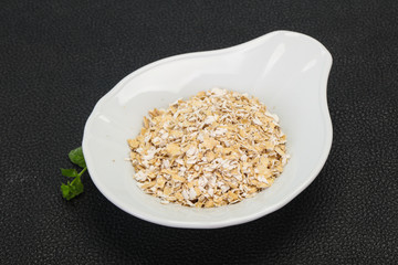 Raw oats in the bowl
