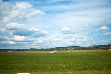 Fototapeta na wymiar landscape with plane and clouds