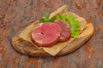 Raw tuna round steak for grill