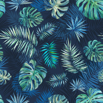 Seamless tropical watercolor pattern on a blue background. Palm leaves, monstera leaves.
