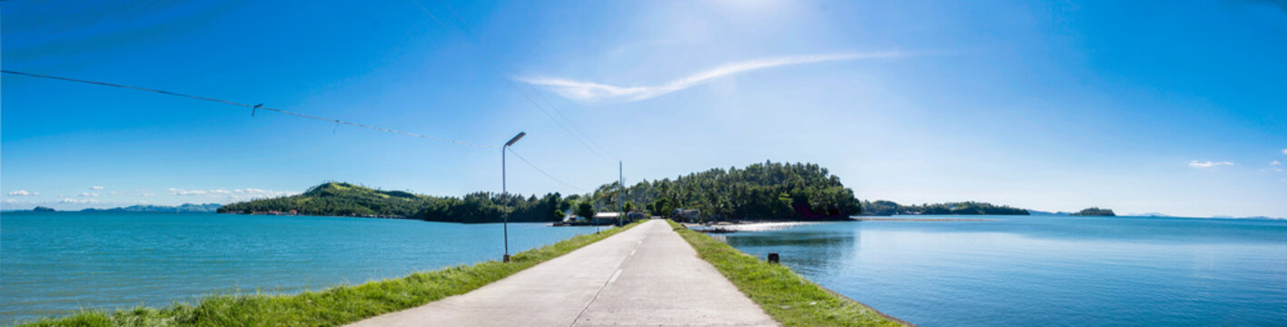 Panoramic shot of causeway in Buri Island near Catbalogan in Samar. Wide panorama of coastal road onroute to small village.