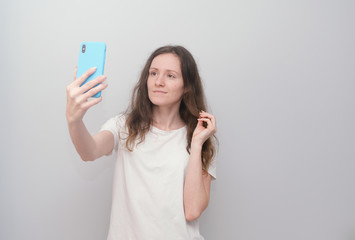 Girl talking on the phone with realatives during quarantine, covid-19, corona virus.