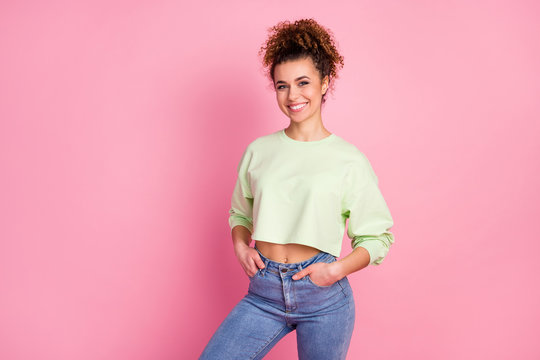 Portrait of her she nice-looking attractive lovely pretty content cheerful cheery girl wearing green crop top posing isolated over pink pastel color background