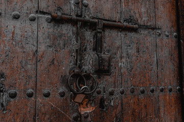 typical old wooden door in the medina of Fes. It also uses an old locker!!