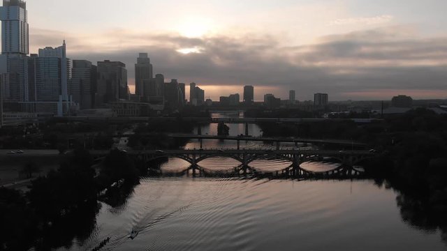 A rowing crew workout on the Colorado River in Austin, Texas at sunrise as captured by a drone.