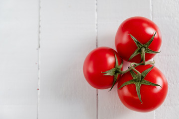 Cherry Tomatoes on White Planks Background