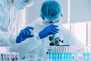 Two of Scientists trying to find vaccine covid19 to defeat the coronavirus in Laboratory area. Many...