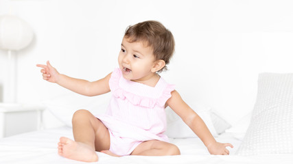 Portrait of a baby in bed