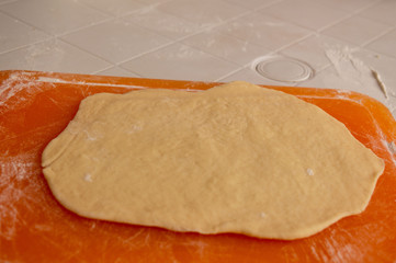 Dough rolled out for baking.