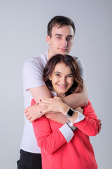 mother and son hugged on a white background