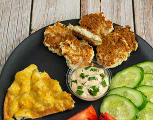 Chicken fritters with vegetables and eggs with cauliflower and sauce