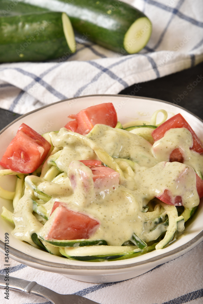 Wall mural Zucchini with basil pesto alfredo sauce