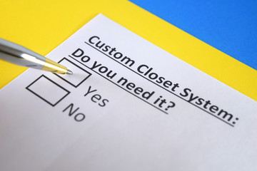 Obraz premium One person is answering question about custom closet system.