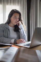 Girl studying and working at home