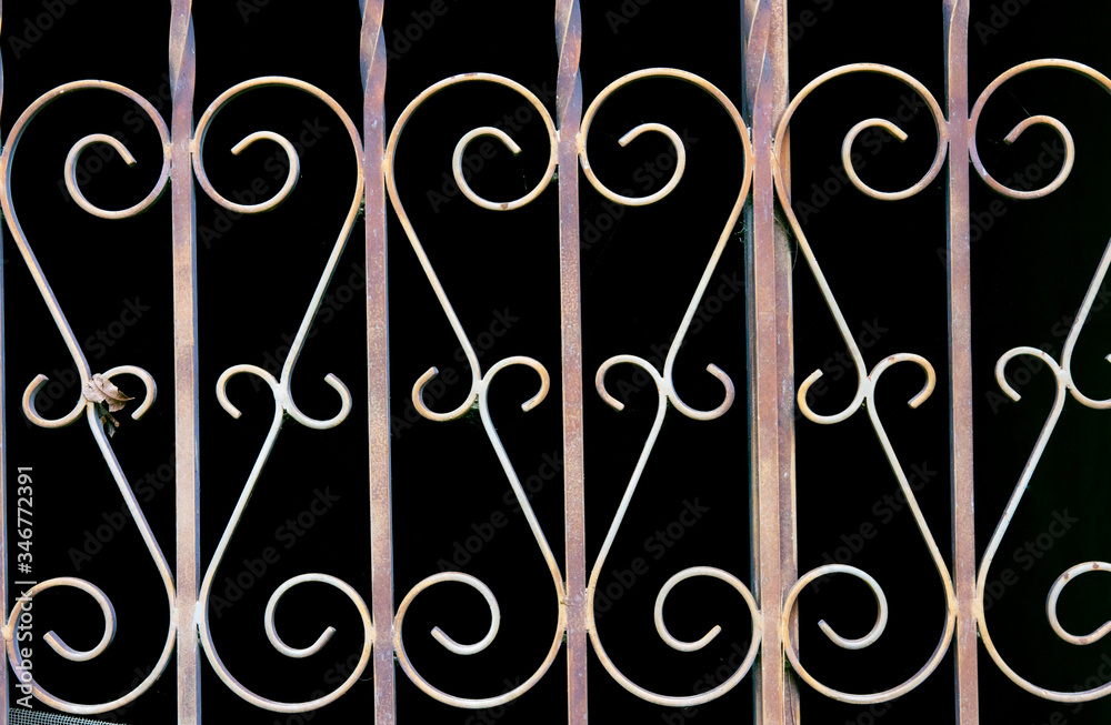 Wall mural curved forged metal gate detail