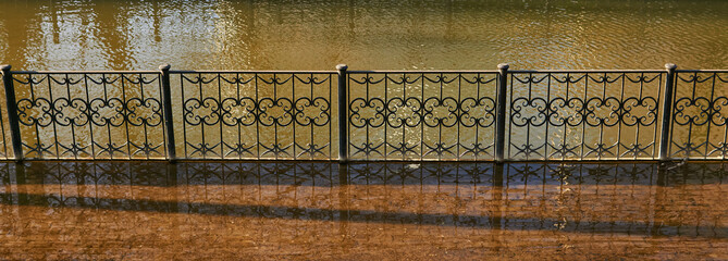 flooded city canal embankment