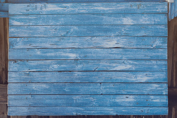 Blue horizontal vintage wood background texture with knots and nail holes. Old wood planks painted with blue paint. Wooden background.