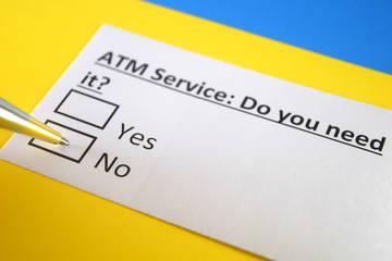 Obraz premium One person is answering question about ATM service.