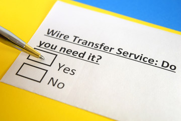 Obraz premium One person is answering question about wire transfer service.