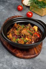 Lamb roast in a black iron plate